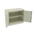 A light gray, metal cabinet with two doors open to reveal two shelves inside. The cabinet is empty and positioned against a white background.