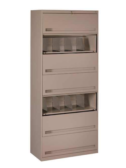 A tall, beige metal filing cabinet with five drawers. Some drawers have clear slots holding dividers, and one drawer at the top is slightly open, revealing a key lock. The cabinet stands against a plain white background.