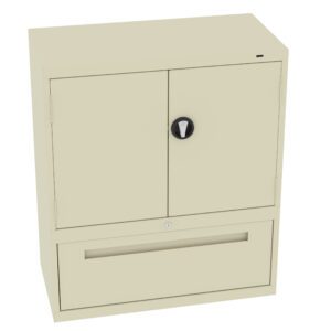A beige, two-door metal cabinet with a black round handle on the front. It has a large drawer at the bottom. The design is simple and functional, suitable for office or home storage.