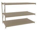 Three-tier beige metal shelving unit with grated shelves viewed from an angle. The shelves are evenly spaced and supported by a sturdy frame with side supports. The unit is empty and set against a white background.