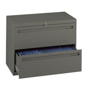 A green metal filing cabinet with two drawers. The top drawer is closed with a key lock, and the bottom drawer is open, revealing a row of blue file folders inside.