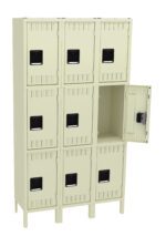A beige metal locker unit with three rows and three columns of square compartments. One locker door is open, revealing an empty interior. The lockers have black handles and a simple, industrial design.
