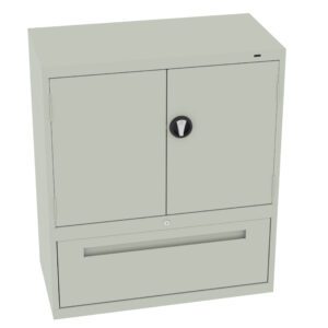 A light gray metal storage cabinet with two doors on top and a large drawer at the bottom. The cabinet is equipped with a round lock handle on the doors and a small keyhole on the drawer.