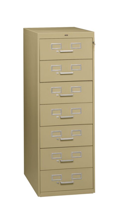 npp81hgzmudvflqgwltt.jpg A beige, six-drawer filing cabinet with silver handles and label slots. The cabinet is upright and closed, with a keyhole on the top right. Its positioned against a plain white background.