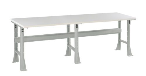 A long, rectangular white table with a sturdy, light gray metal frame and four angled legs. The design is simple and functional, suitable for various purposes like workspaces or utility areas.