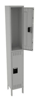 A tall, gray metal locker with two compartments. The top door is open, revealing an empty interior, while the bottom door remains closed. Both doors have ventilation slits and built-in locks. The locker stands on short legs.