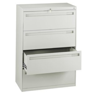 A beige, three-drawer filing cabinet with the bottom drawer open. It has a modern, minimalist design, and a lock at the top. The drawers have sleek horizontal handles.