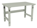 A beige, adjustable-height workbench with a flat rectangular surface and sturdy metal legs. The legs have holes for adjusting height and support a horizontal beam for added stability. The design is simple and functional, suitable for various tasks.