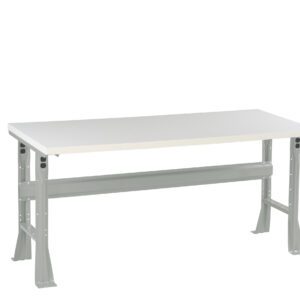 A gray metal workbench with a white tabletop, featuring adjustable legs for height customization. The bench is isolated against a white background.