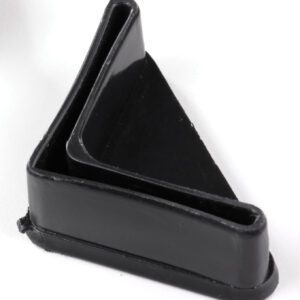 A black, triangular-shaped rubber doorstop with a slanted design, placed upright on a white surface.