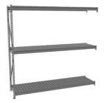Gray metal shelving unit with three wide, horizontal shelves. The unit has an open design with vertical supports on the left side and no visible back or side panels. The shelves have a slatted surface, suitable for storage purposes.