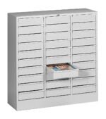 Gray multi-drawer storage cabinet with 30 small rectangular drawers, one of which is open revealing neatly stacked brochures inside. The drawers feature label holders and recessed handles.