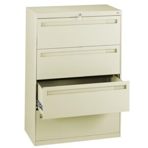 A beige metal filing cabinet with three drawers. The top two drawers are closed, and the bottom drawer is partially open, revealing its storage space. The cabinet has a sleek, modern design and a lock at the top.