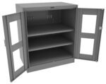 A gray metal cabinet with two open doors revealing three empty shelves inside. The doors have transparent panels and the cabinet is set against a plain white background.