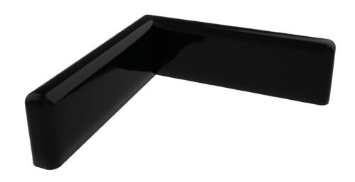 A glossy black L-shaped object with rounded edges, resembling a corner protector or furniture edge guard, positioned at an angle on a plain white background.