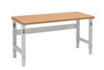 A rectangular workbench with a wooden top and adjustable metal legs. The legs are gray, featuring multiple bolt holes for height adjustment. The design is simple and functional, suitable for workshops or garages.