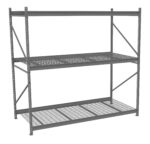 A large, empty, industrial metal shelving unit with three levels. The shelves have a grid pattern, supported by four vertical metal beams. The structure is gray and has cross braces on the sides for added stability.