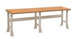 A long, industrial-style workbench featuring a wooden tabletop and sturdy, adjustable metal legs in a neutral color. The design is simple and functional, suitable for various workshop or garage environments.