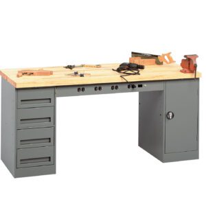 A large workbench with a wooden top and metal base features multiple drawers on one side and a cabinet on the other. Various tools, including clamps and measuring devices, are scattered on the surface.