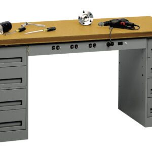 A sturdy workbench with a wooden top and two sets of metal drawers on each side. Tools are scattered on the surface, including a drill, a clamp, and wrenches. The drawers have handles for easy access.