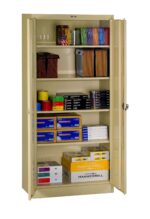 A beige storage cabinet with open doors displaying various office supplies. Shelves hold colored paper, binders, file folders, and boxes of Hammermill paper. The cabinet is organized and well-stocked.