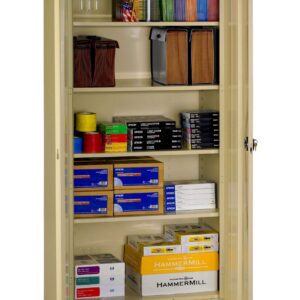 A beige storage cabinet with open doors displaying various office supplies. Shelves hold colored paper, binders, file folders, and boxes of Hammermill paper. The cabinet is organized and well-stocked.