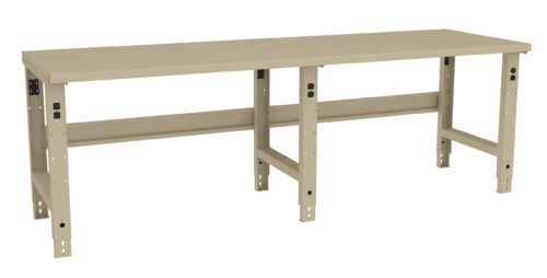 A long, beige workbench with adjustable legs and a flat surface. The design is simple and industrial, with visible holes in the legs for customization of height. Suitable for a workshop or garage setting.