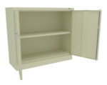 A beige metal cabinet with a single shelf is open, displaying its empty interior. The cabinet has a simple design, with one door fully open to the right and a handle on the left.