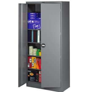 A metal storage cabinet with an open door, revealing shelves stocked with various office supplies, including reams of paper, boxes of binders, rolls of tape, and other items. The cabinet is gray and has a round handle.