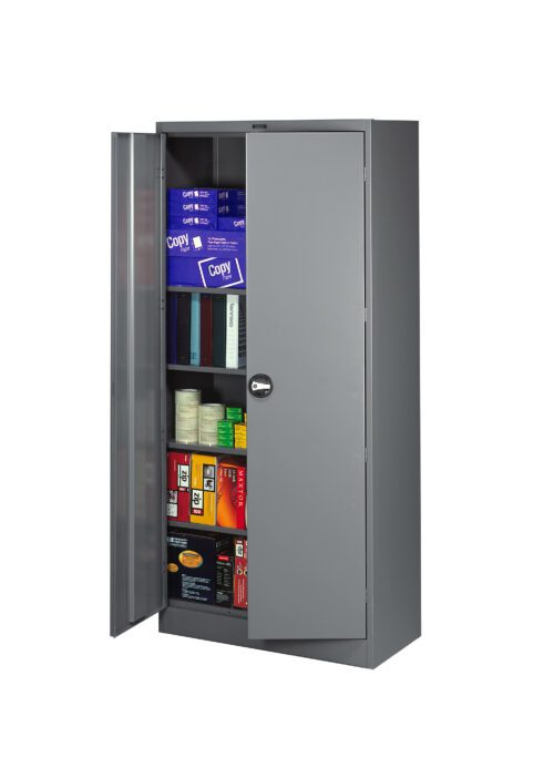 A metal storage cabinet with an open door, revealing shelves stocked with various office supplies, including reams of paper, boxes of binders, rolls of tape, and other items. The cabinet is gray and has a round handle.