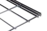 Close-up of a metal framework with parallel bars, intersecting at right angles. The shiny metallic structure is isolated against a white background, showcasing its minimalist and engineered design.