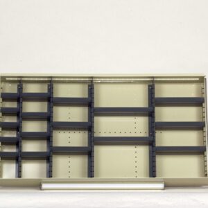 Empty metal shelving unit with multiple horizontal and vertical dividers against a plain background. The shelves are beige with dark gray edges and brackets.