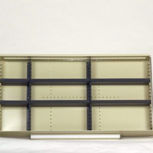 An empty beige shelf with multiple compartments and black horizontal dividers against a light background.