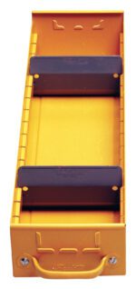 A yellow metal shelf with a handle at the bottom and two black horizontal dividers. The unit has an industrial design with visible brackets and a textured surface.