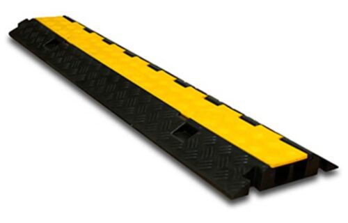 Meet the TCT 2 - Channel Light Duty Cable Protector: a black-and-yellow, elongated design with a textured surface that shields cables and reduces tripping risks. It features a central yellow strip framed by durable black sections for enhanced safety.
