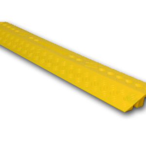 The Yellow TCT Small Cable Cover 39.25x5.25x0.845 features a textured surface and a channel size of 1.5x0.5, designed to protect cables and reduce tripping hazards with its narrow shape and bottom grooves for cable accommodation.