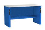 A blue workbench with a white tabletop and integrated power outlets on both sides. The design is simple and functional, featuring a lower shelf for additional storage or workspace.