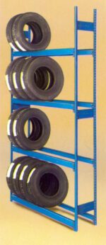 A blue metal rack holding three shelves of black tires. Each shelf contains several stacked tires, organized neatly. The background is a plain, light color.