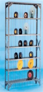 A metal shelving unit with multiple tiers, displaying various circular grinding wheels in different sizes=