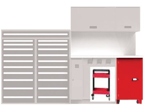 A light gray workbench setup with upper cabinets, a red rolling tool cabinet beneath, and a panel with horizontal slots on the left. A small red rolling cart is partially visible under the bench.