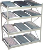 A metal storage rack with four shelves, each holding multiple flat metal trays arranged side by side. The structure has a beige frame and cross braces on the sides for support.