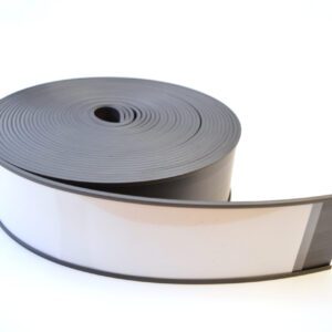 A roll of MH-USA Magnetic Label Holder tape, flat and flexible, is slightly uncoiled on a white surface. The dark gray material contrasts with its distinctive white stripe on one side and measures H.2.36 in. x W3.94 in.