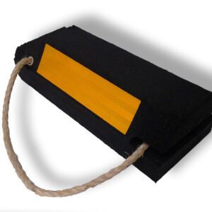 The TCT Military Wheel Chock features double-sided black construction, a yellow reflective strip for visibility, and a rope handle. Dimensions: 14x5.5x3.5.