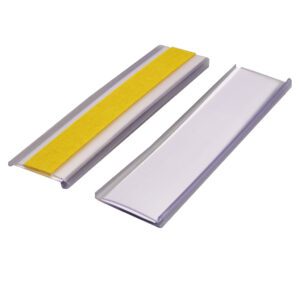 Two rectangular metallic objects are shown on a white background: a plain silver one and another with a yellow strip. Both have slightly raised edges, resembling the elegant design of an MH-USA Self-Adhesive Ticket Holder - H.0.98 in. x W.3.94 in., Pack of 100, Including Card.