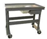 A gray metal utility workbench with a rectangular top and mounted on four caster wheels. It has a small storage drawer underneath and sturdy, angled legs for support.