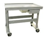 A gray metal utility cart with a flat top and a small drawer underneath. The cart has four sturdy legs and large, black caster wheels for mobility. The design is simple and industrial, suitable for various work environments.