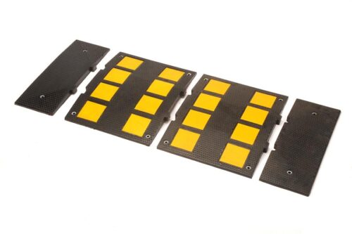 A black modular TCT 10-15 MPH Speed Hump middle section with yellow panels, measuring 18 3/4 wide x 24 long x 1 1/8 tall, is set against a white background.