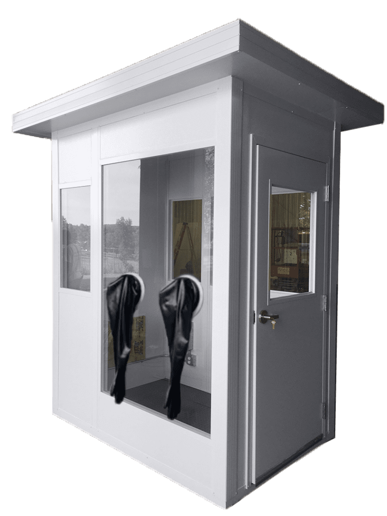 A small, modern white security booth, part of modular buildings collection, features large glass windows and a door. Inside, two black jackets hang on the wall. The booth boasts a flat roof and is showcased against a plain background.