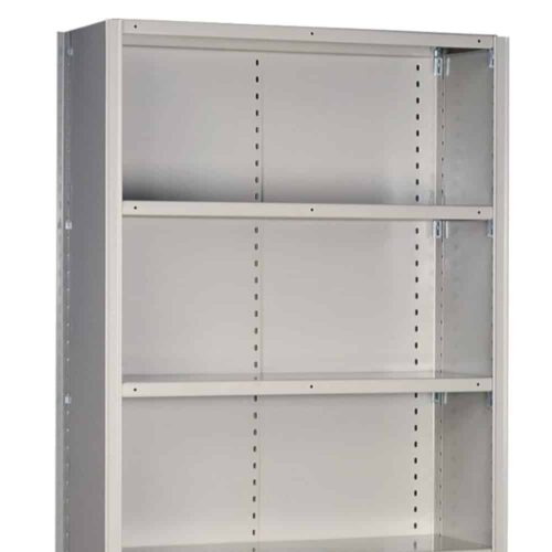 A tall, gray metal shelving unit with three adjustable shelves and perforated sides is shown. The unit is empty and placed against a plain white background.