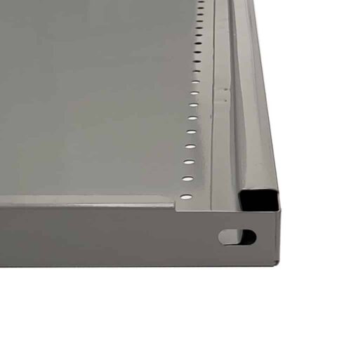 Close-up of a gray metal panel with a perforated edge and a smooth surface. The edge features a series of round holes and a rectangular cutout, suggesting it may be part of a larger frame or structure.
